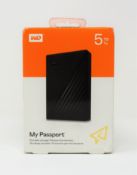 A boxed as new WD My Passport 5TB portable hard drive in black.