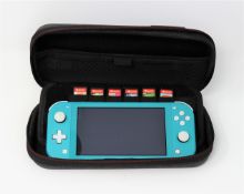 A pre-owned Nintendo Switch Lite HDH-001 Handheld Console in Turquoise with seven pre-owned game