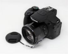 A boxed as Canon PowerShot SX60 HS Camera (P/N: PSSX60HS-E ) (UK power cable included) (Box