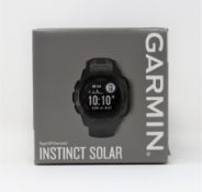A boxed as new Garmin Instinct Solar Rugged GPS Smartwatch in Graphite Black(010-02293-00).
