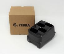 A boxed as new Zebra MC3300 4-Slot Battery Charger (P/N: SAC-MC33-4SCHG-01).