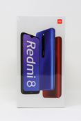 A boxed as new Xiaomi Redmi 8 3GB/32GB in Sapphire Blue (Box sealed. Two pin plug).
