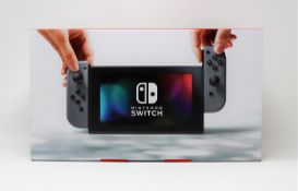 A boxed as new Nintendo Switch Console in Grey (M/N: HAC-S-KAAAA-JPN) (Some packaging text in