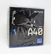 A boxed as new Astro A40 TR gaming headset for games consoles and PC inblack/silver (box damaged).