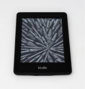 A pre-owned Amazon Kindle Paperwhite (M/N: EY21) in Black.