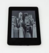 A pre-owned Amazon Kindle Paperwhite (M/N: DP75SDI) in Black.