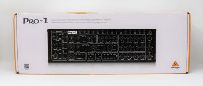 A boxed as new Behringer PRO-1 Dual-VCO Analog Desktop Synthesizer (Box opened) (Two pin plug).