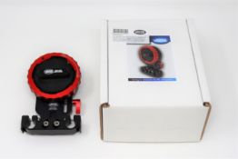 A boxed as new Vocas Sony E-mount to PL adapter including 15 mm rail support (P/N: 0900-0015).