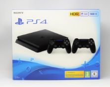 A boxed as new 500GB Sony PlayStation 4 games console in jet black (box damaged) (2 pin power