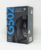 A boxed as new Logitech G502 gaming mouse in black.