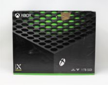 A boxed as new Xbox Series X 1TB games console in black (model: 1882) (box opened) (box damaged).