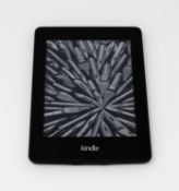 A pre-owned Amazon Kindle Paperwhite (M/N: DP75SDI) in Black.