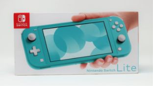A boxed as new Nintendo Switch Lite Console in Turquoise (M/N: HDH-S-BAZAA-AUS) (Two pin plug