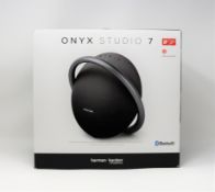 A boxed as new Harman Kardon Onyx Studio 7 Bluetooth Speaker in Black (Box opened).