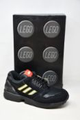 A pair of as new Adidas ZX 8000 Lego black sneakers (UK 11).