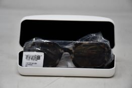 A pair of as new Calvin Klein sunglasses.