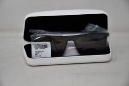 A pair of as new Calvin Klein sunglasses.
