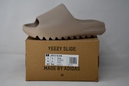 A pair of as new Adidas Yeezy Slide (UK 8).