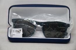 A pair of as new Lacoste sunglasses.