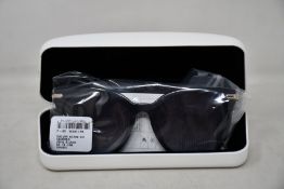 A pair of as new Calvin Klein sunglasses.