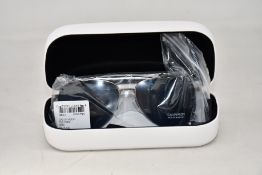 A pair of as new Calvin Klein sunglasses.