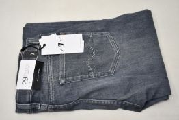 A pair of women's as new 7 For All Mankind The Skinny jeans with Swarovski crystals (Size 29).