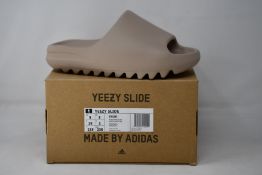 A pair of as new Adidas Yeezy Slide (UK 5).
