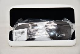 A pair of as new Calvin Klein sunglasses.