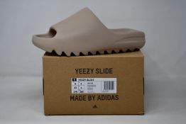A pair of as new Adidas Yeezy Slide (UK 9).