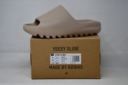 A pair of as new Adidas Yeezy Slide (UK 9).