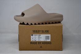 A pair of as new Adidas Yeezy Slide (UK 9).