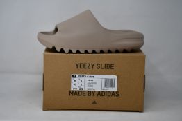 A pair of as new Adidas Yeezy Slide (UK 6).