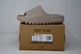 A pair of as new Adidas Yeezy Slide (UK 6).