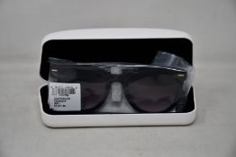 A pair of as new Calvin Klein sunglasses.