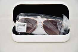 A pair of as new Calvin Klein sunglasses.