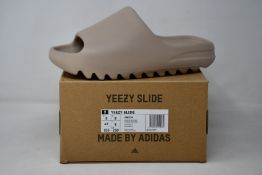 A pair of as new Adidas Yeezy Slide (UK 8).