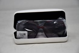 A pair of as new Calvin Klein sunglasses.