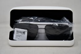 A pair of as new Calvin Klein sunglasses.