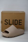 A pair of as new Adidas Yeezy Slide (UK 7).