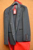 An as new Hugo Boss packable slim fit suit in dark grey (UK 48).