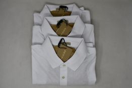 Three as new Burberry polo shirts in white (L).