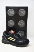 A pair of as new Adidas ZX 8000 Lego black sneakers (UK 12).