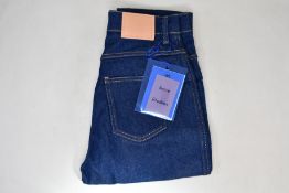 A pair of as new ACNE Studios 1994 indigo jeans (W24/L30).