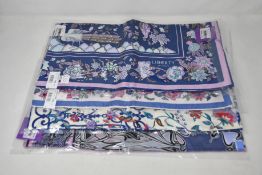 Four assorted as new Liberty of London scarves.
