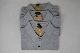 Three as new Burberry polo shirts in grey (M).