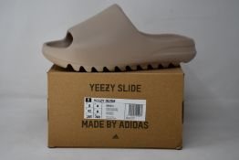 A pair of as new Adidas Yeezy Slide (UK 8).