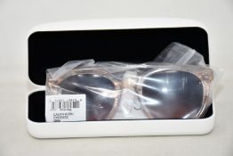 A pair of as new Calvin Klein sunglasses.