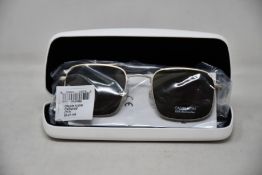 A pair of as new Calvin Klein sunglasses.