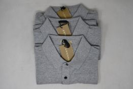 Three as new Burberry polo shirts in grey (L).