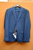 An as new Tommy Hilfiger suit in blue (EU 52).